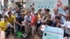 Pro-democracy lawmakers and activists gather in Hong Kong island’s Causeway Bay shopping district to promote plans for an unofficial referendum on democratic reform, May 25, 2014.