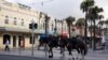 Mounted police officers patrol following the implementation of stricter social-distancing and self-isolation rules to limit the spread of the coronavirus, in the Manly suburb of Sydney, Australia, April 6, 2020. 