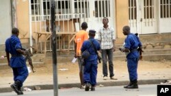 FILE - Police arrest a man in Bujumbura, Burundi, Feb. 3, 2016. Widespread rights violations and repressive measures in the country are hidden behind a façade of democracy, U.N. investigators have found.