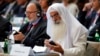 Participants plug in their translator devices during the opening of an international conference on religious and ethnic minorities being persecuted under the Islamic State group, in Paris, France, Sept. 8, 2015. 