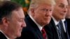 U.S. President Donald Trump flanked by Secretary of State Mike Pompeo and White House Chief of Staff John Kelly attend a lunch with Singapore's Prime Minister Lee Hsien Loong and officials at the Istana in Singapore, June 11, 2018. 