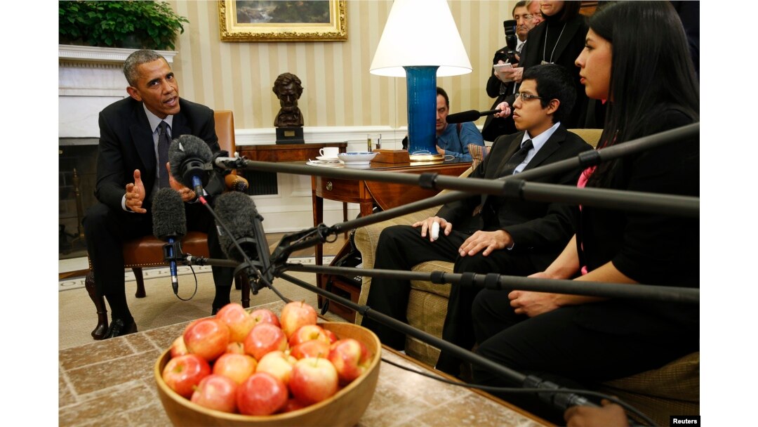 FILE - Then-President Barack Obama meets with a group of "dreamers" who have received Deferred Action for Childhood Arrivals (DACA) at the White House in Washington, Feb. 4, 2015.
