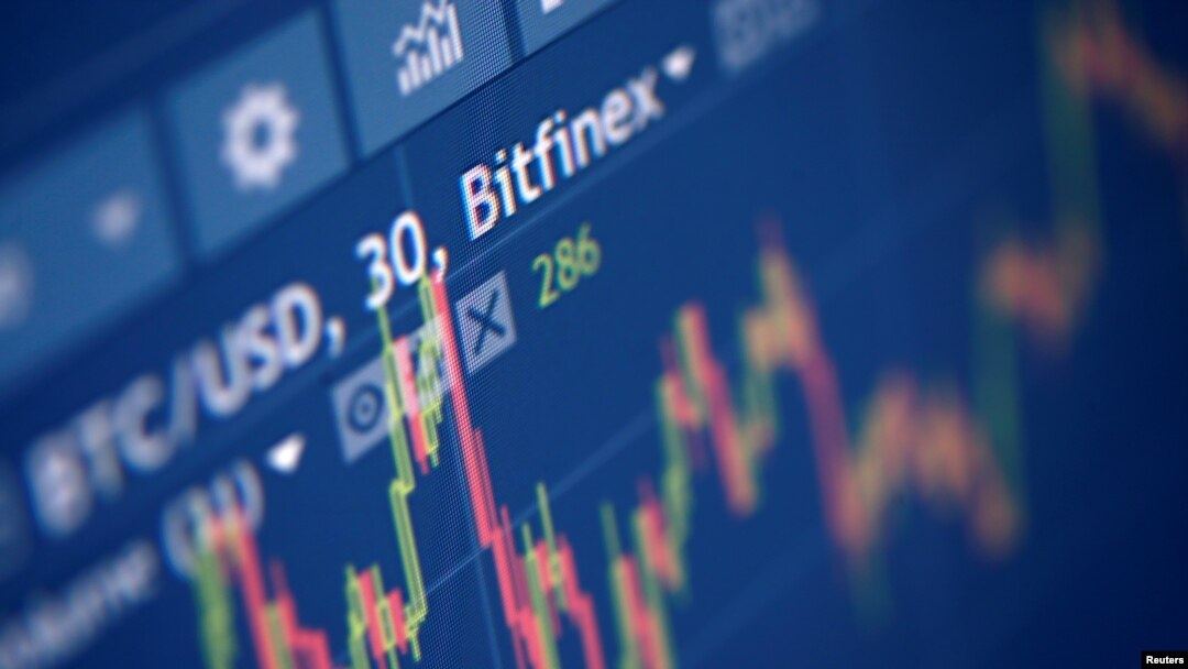 FILE - Photo illustration of Bitfinex cryptocurrency exchange website taken Sept. 27, 2017.