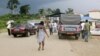 FILE - People wait to cross the border into Equatorial Guinea by car and by foot in Kye-Ossi, Cameroon, May 23, 2015. 