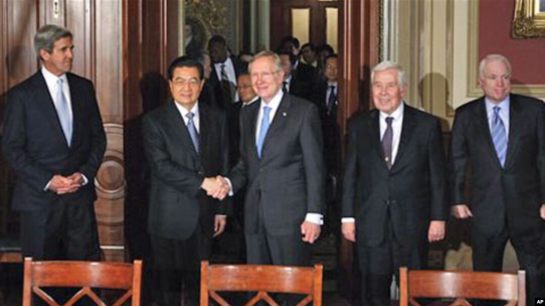 Senate Majority Leader Harry Reid greets China's President Hu Jintao on Capitol Hill in Washington, 20 Jan 2011