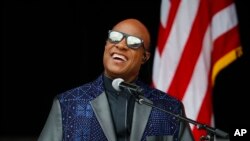 FILE - Singer Stevie Wonder performs at the dedication ceremony for the Smithsonian Museum of African American History and Culture on the National Mall in Washington, Sept. 24, 2016.