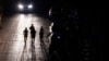 Joggers exercise on a dark street in San Juan, Puerto Rico, after a major power outage hit the island on Dec. 31, 2024.