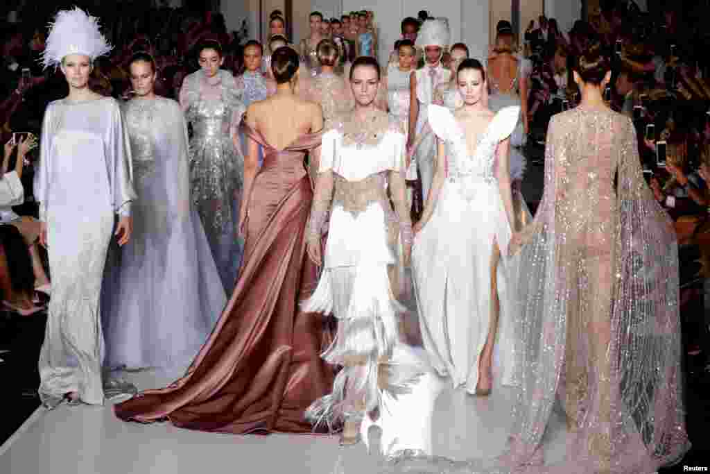 Models present creations by Australian designers Tamara Ralph and Michael Russo as part of their Haute Couture Fall/Winter 2017-2018 collection show for Ralph & Russo in Paris, France.