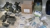 In this photo taken on a government-organized tour, canisters and other material that the Syrian military says it uncovered in a raid on a rebel hideout are lined up, in the Jobar neighborhood of Damascus, Aug. 24, 2013. 