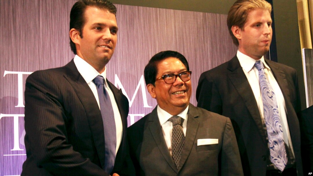 FILE - Philippines Trump TowerDonald Trump Jr., left, and Eric Trump, right, sons of Donald Trump, pose with local developer Jose E. B. Antonio at the launching of Manila's Trump Tower project June 26, 2012 in the Philippines.