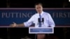 Republican presidential candidate Mitt Romney gestures during a campaign stop at Production Products in St. Louis, Missouri, June 7, 2012.
