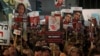 Relatives and supporters hold placards bearing portraits of Israeli hostages held in Gaza since the October 7 attacks by Hamas in southern Israel, during a rally calling for their release and marking their nearly 100 days of captivity, in Tel Aviv on Janu