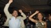 Roland and Natalie Jones celebrate as President Barack Obama is predicted as the winner over challenger Mitt Romney at a Colorado Democrat's election party at the Sheraton Hotel in Denver on Nov. 6, 2012. 