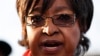 Winnie Madikizela-Mandela addresses the media in front of the house of her former husband and former South African President Nelson Mandela in Soweto, June 28, 2013. 