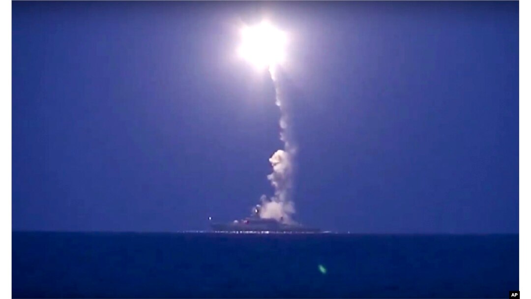 In this photo made from the footage taken from Russian Defense Ministry official website, a Russian navy ship on the Caspian Sea launches a cruise missile toward Islamic State targets in Syria, the ministry said, Oct. 7, 2015.