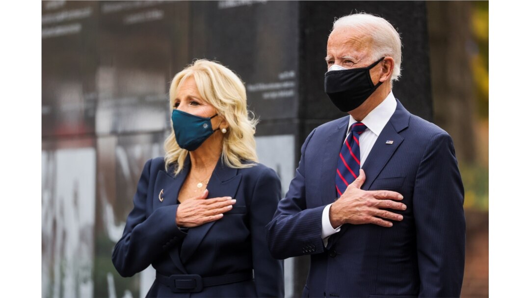 FILE - U.S. President-elect Joe Biden, accompanied by his wife Jill, attends a Veterans Day observance in Philadelphia, Pennsylvania, Nov. 11, 2020.