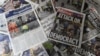 An arrangement of newspapers pictured in London on March 23, 2017, as an illustration, shows the front pages of the UK daily newspapers reporting on the March 22 terror attack.