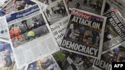 An arrangement of newspapers pictured in London on March 23, 2017, as an illustration, shows the front pages of the UK daily newspapers reporting on the March 22 terror attack.