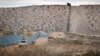 FILE - A U.S. Border Patrol agent drives near the U.S.-Mexico border fence in Sunland Park, New Mexico, Jan. 4, 2016. 