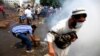Supporters of Egypt's ousted President Mohammed Morsi clash with the Egyptian security forces as the forces clear their sit-in camp in the eastern Nasr City district of Cairo, Aug. 14, 2013.