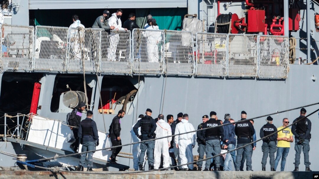 FILE - Migrants disembark from an Italian navy ship at the port of Shengjin, northwestern Albania, Nov. 8, 2024.