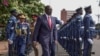 FILE - Kenyan President William Ruto, center, reviews the honor guard in Nairobi, Kenya, on Nov. 21, 2024. Ruto announced on Nov. 30, 2024, that he and the president of Uganda will help mediate a dispute between Somalia and Ethiopia.