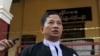 Than Zaw Aung, lawyer for Reuters journalists Wa Lone and Kyaw Soe Oo, talks to journalists after their trial, Feb. 1, 2018, outside Yangon, Myanmar. 