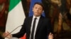 Italian Prime Minister Matteo Renzi speaks during a press conference at the premier's office Chigi Palace in Rome, early Monday, Dec. 5, 2016. Renzi acknowledged defeat in a constitutional referendum and announced he would resign on Monday. 