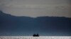 FILE - Chinese fishing trawlers anchor off the coast of Freetown, Nov. 18, 2012.