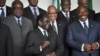 South Africa's President Jacob Zuma, center-right, and Zimbabwe's President Robert Mugabe, center-left, share a joke as Gabon's President Ali Bongo Ondimba, right, looks on at the African Union summit in Addis Ababa, Ethiopia, May 26, 2013. 