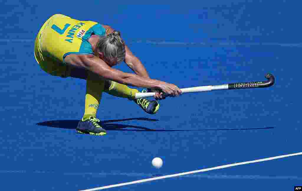 Jodie Kenny of Australia hits the ball during the bronze medal field hockey match between Australia and Spain of the 2018 Women's Hockey World Cup at the Lee Valley Hockey and Tennis Centre in London.