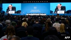 INC-5 Chair Luis Vayas Valdivieso (on screen) speaks during an open plenary session during the fifth session of the UN Intergovernmental Negotiating Committee on Plastic Pollution (INC-5) in Busan, South Korea, Dec. 1, 2024. 
