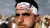 FILE - A Houthi supporter wears a headband praising the Houthi movement for making drone aircraft as he attends a pro-Houthi rally in Sana'a, Yemen March 3, 2017. 