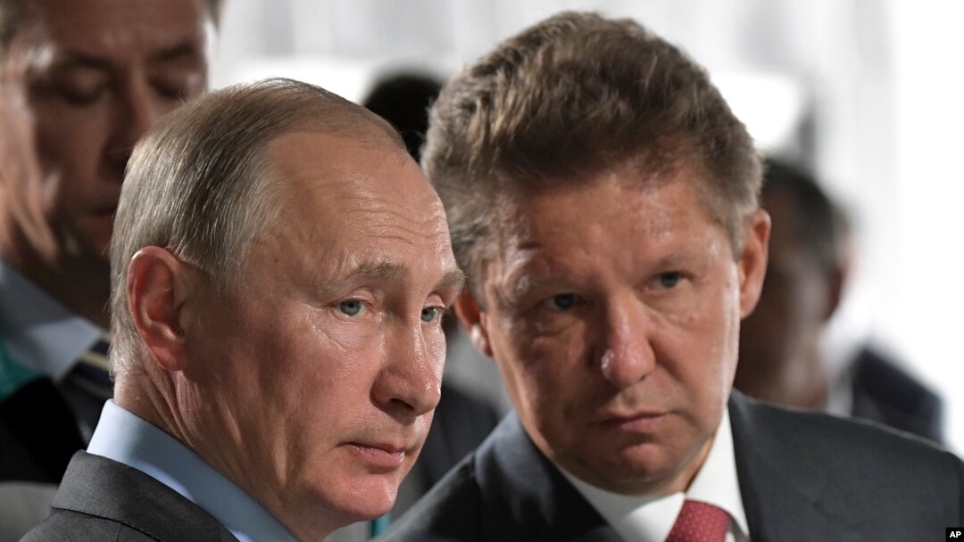 FILE - Russian President Vladimir Putin, left, and Alexei Miller, Russian natural gas giant Gazprom CEO.