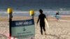 A sign tells surfers to leave once they have finished surfing at Bondi Beach in Sydney, April 28, 2020, as coronavirus pandemic restrictions are eased.