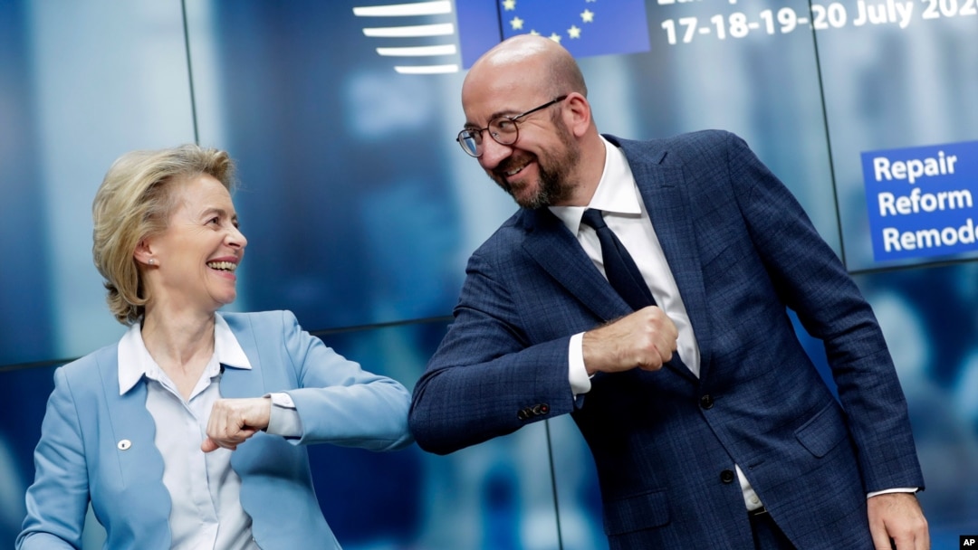 European Commission President Ursula von der Leyen, left, and European Council President Charles Michel bump elbows after addressing a media conference at an EU summit in Brussels, Tuesday, July 21, 2020. Weary European Union leaders finally…