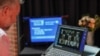 A pastor interacts with parishioners via a laptop upon concluding a live-streamed Easter service due to social gathering restrictions implemented to curb the spread of COVID-19, at an Anglican church in Sydney, Australia, April 12, 2020.