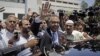 Makhdoom Shahabuddin, nominated prime minister by the ruling Pakistan People's party, waves after filing his papers in Islamabad, Pakistan, June 21, 2012.