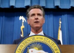 FILE - California Gov. Gavin Newsom addresses a news conference in Sacramento, July 23, 2019.