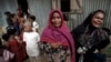 Rohingya refugees react before the funeral of a family member, who they say succumbed to injuries inflicted by the Myanmar Army before their arrival, in Cox's Bazar, Bangladesh, Sept. 29, 2017.