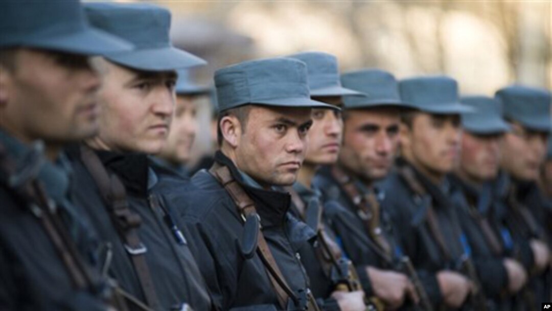 In this Feb. 20, 2011 photo provided by NATO Training Mission-Afghanistan, trainees at the Afghan National Police Academy stand in formation during a visit to the academy by a U.S. Congressional delegation in Kabul, Afghanistan.