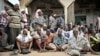 FILE - Somalians come out onto the streets after the government and AU troops drive al-Shabab militants from their community as part of military offensive to oust al-Shabab from its last major hideouts.