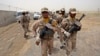 FILE - Iranian border guards march at the eastern border of Iran shared with Pakistan, July 19, 2011. Stability in Baluchistan, the Pakistani province bordering Iran, is considered crucial to implementing the China-Pakistan Economic Corridor, funded by China.
