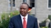 Kenya's President Uhuru Kenyatta prepares to inspect a guard of honor before the opening of the 11th Parliament at the National Assembly Chamber in Nairobi, April 16, 2013.