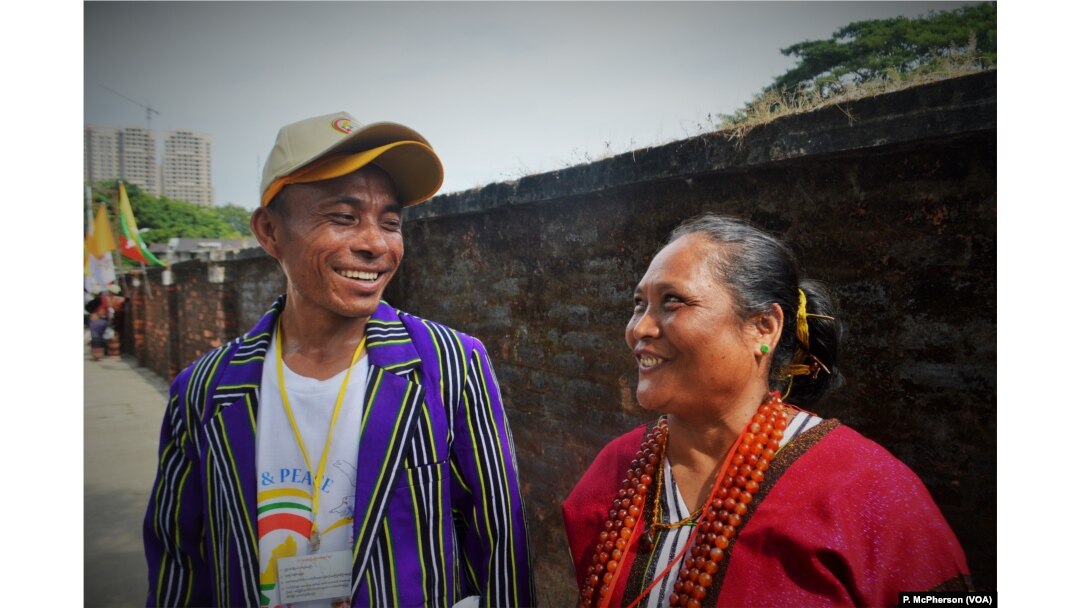 Gabriella Bousein, right, and Raymond Mon Ki, who came from far-flung Chin state for the papal mass in Yangon on Wednesday.