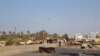 Demonstrators, hoping to pressure the government into fulfilling their demands, block the roads outside of Tripoli, Lebanon, Nov. 15, 2019. (Heather Murdock/VOA)