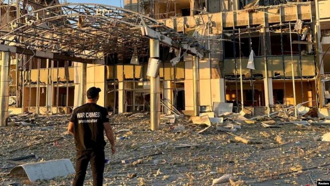 A member of Odesa Regional Prosecutor's Office personnel inspects damage following a Russian military attack in Odesa, Ukraine, in this image released Sept. 25, 2023.