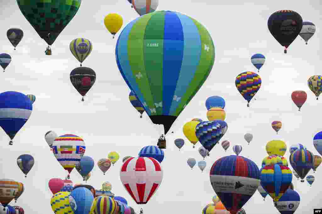 Hot-air balloons are seen at the Chambley-Bussieres airbase, near Hageville, eastern France, before the world record attempt of the biggest line with 456 balloons, as part of the "Mondial Air Ballons."