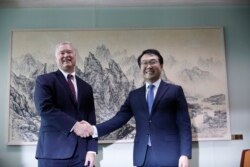 U.S. special envoy for North Korea Stephen Biegun, left, pose with his South Korean counterpart Lee Do-hoon during their meeting at the Foreign Ministry in Seoul, South Korea, Wednesday, Aug. 21, 2019.