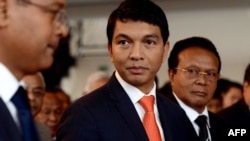 FILE - Madagascar's transitional leader Andry Rajoelina (C) attends a ceremony at Antananarivo's Town Hall, on May 13, 2013.